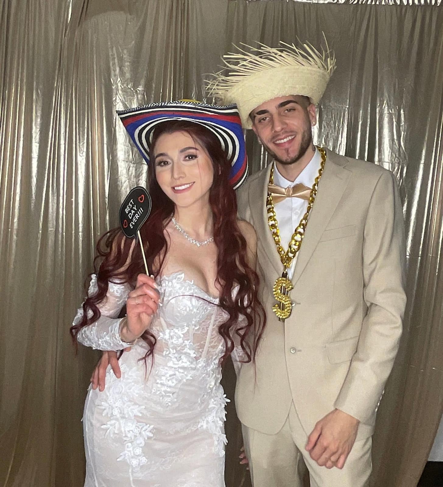 Bride and groom with props at their reception